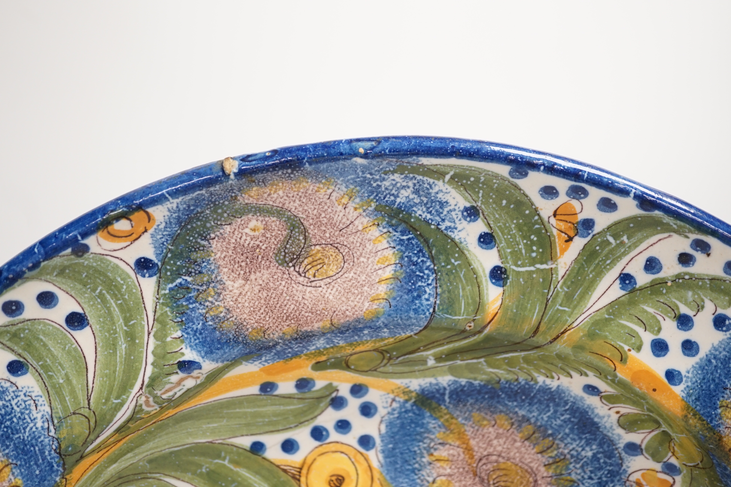 A Spanish polychrome maiolica charger from, 19th century, possibly Valencia, 33cm diameter